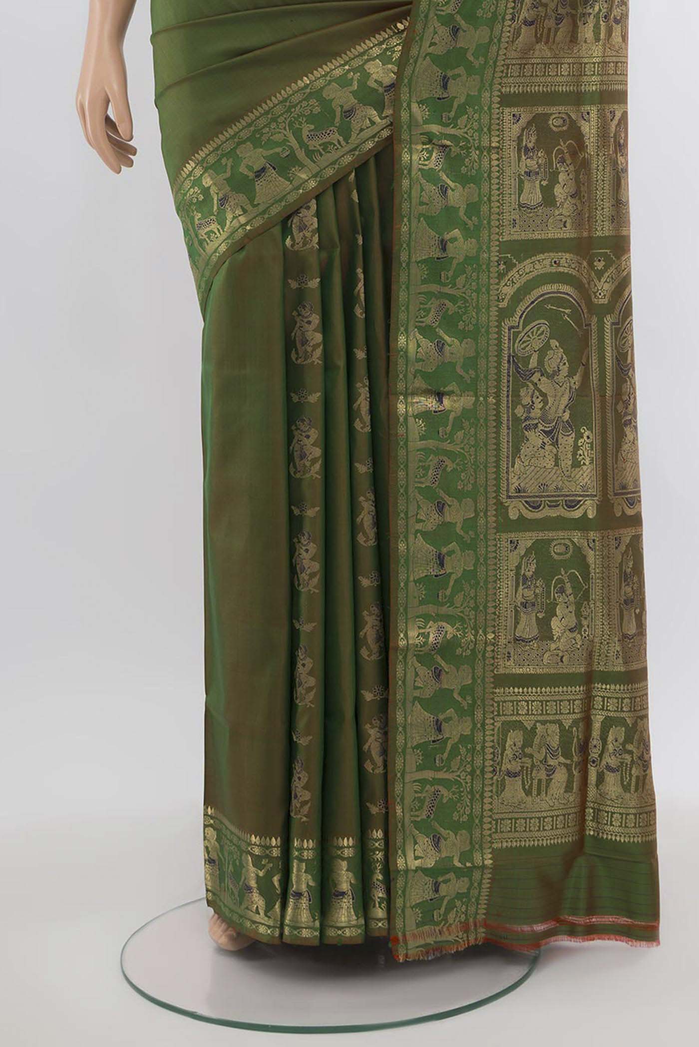 Pleats and pallu of Mehandi Green Baluchari Silk Saree with Zari Butta on the body and Silk Border. 