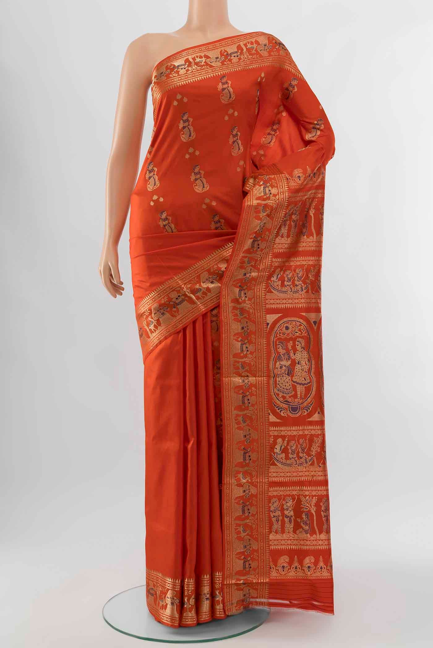 Brick Orange Baluchari Silk Saree with Zari Brocade on the body and Silk Border displayed on a mannequin