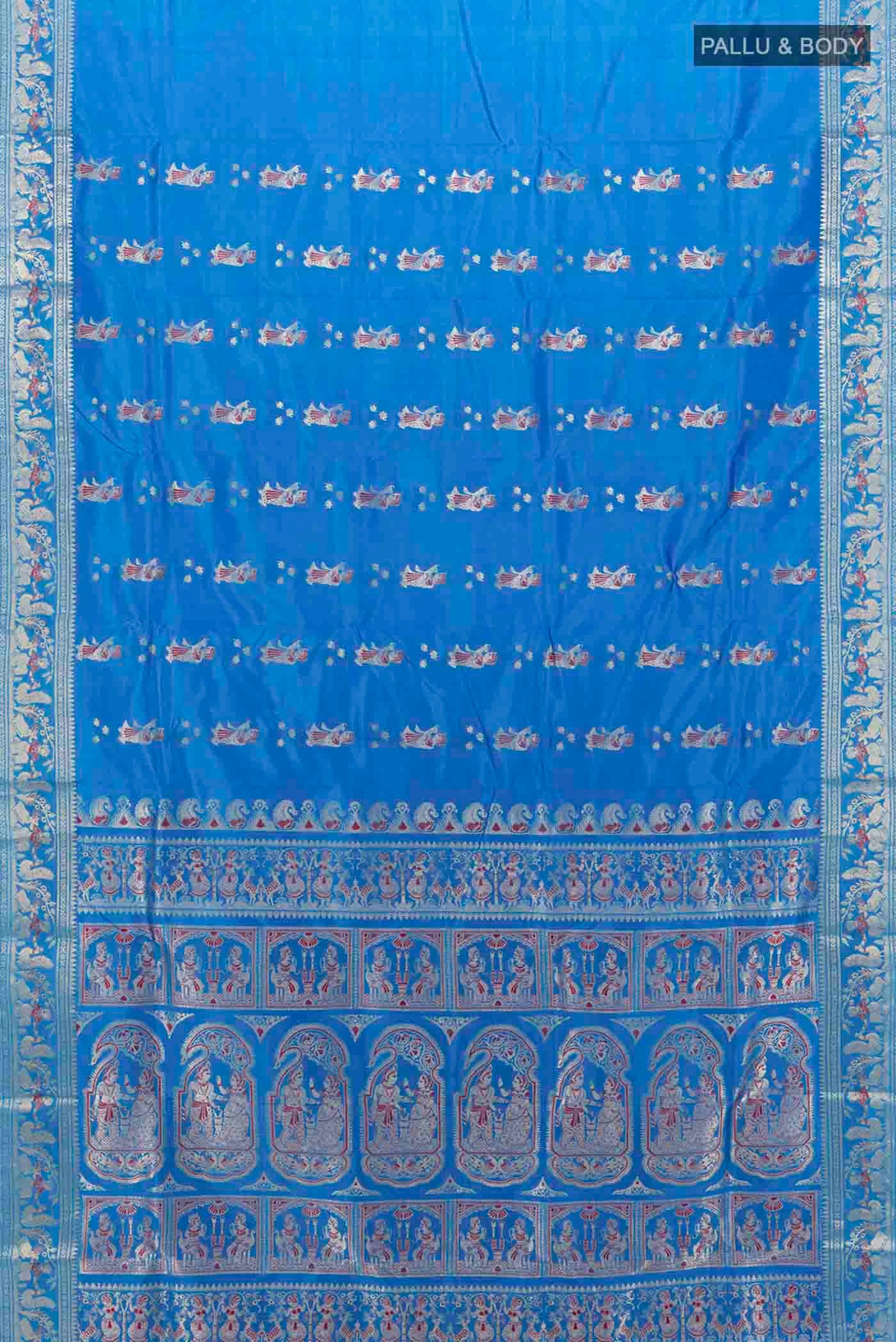 Flat view of Royal Blue Baluchari Silk Saree with Zari And Thread Butta on the body and Zari Border