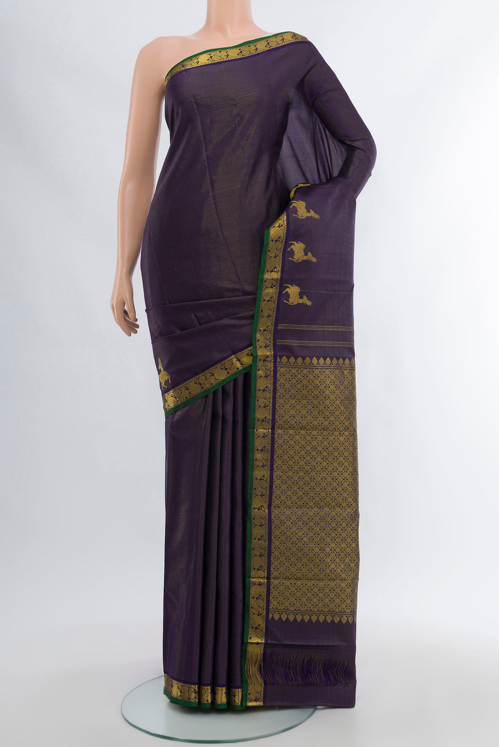 Pure Silk Pure Zari Navy Blue Kanjivaram Saree with Zari Butta on the body and Silk Border.  displayed on a mannequin