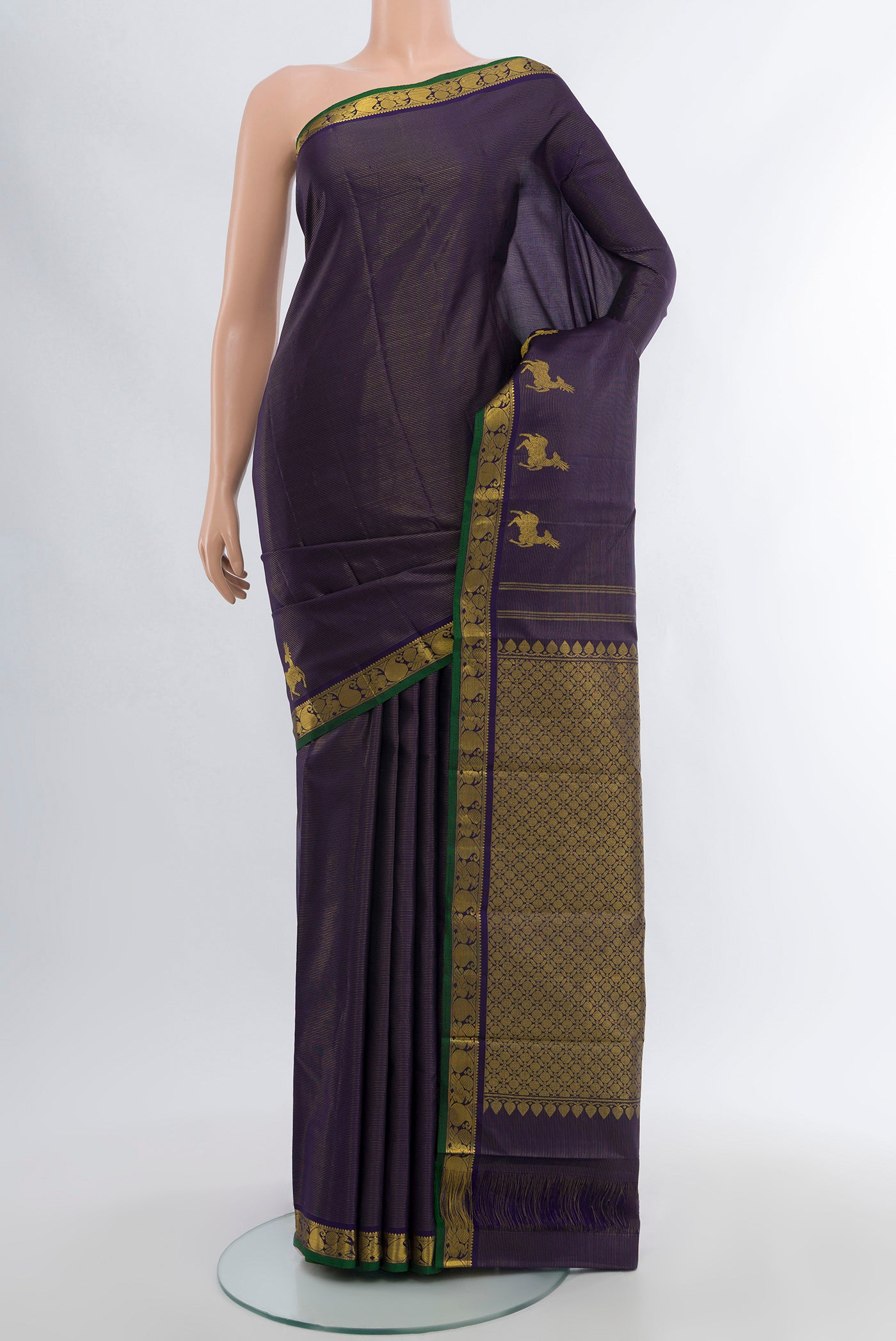 Pure Silk Pure Zari Navy Blue Kanjivaram Saree with Zari Butta on the body and Silk Border.  displayed on a mannequin
