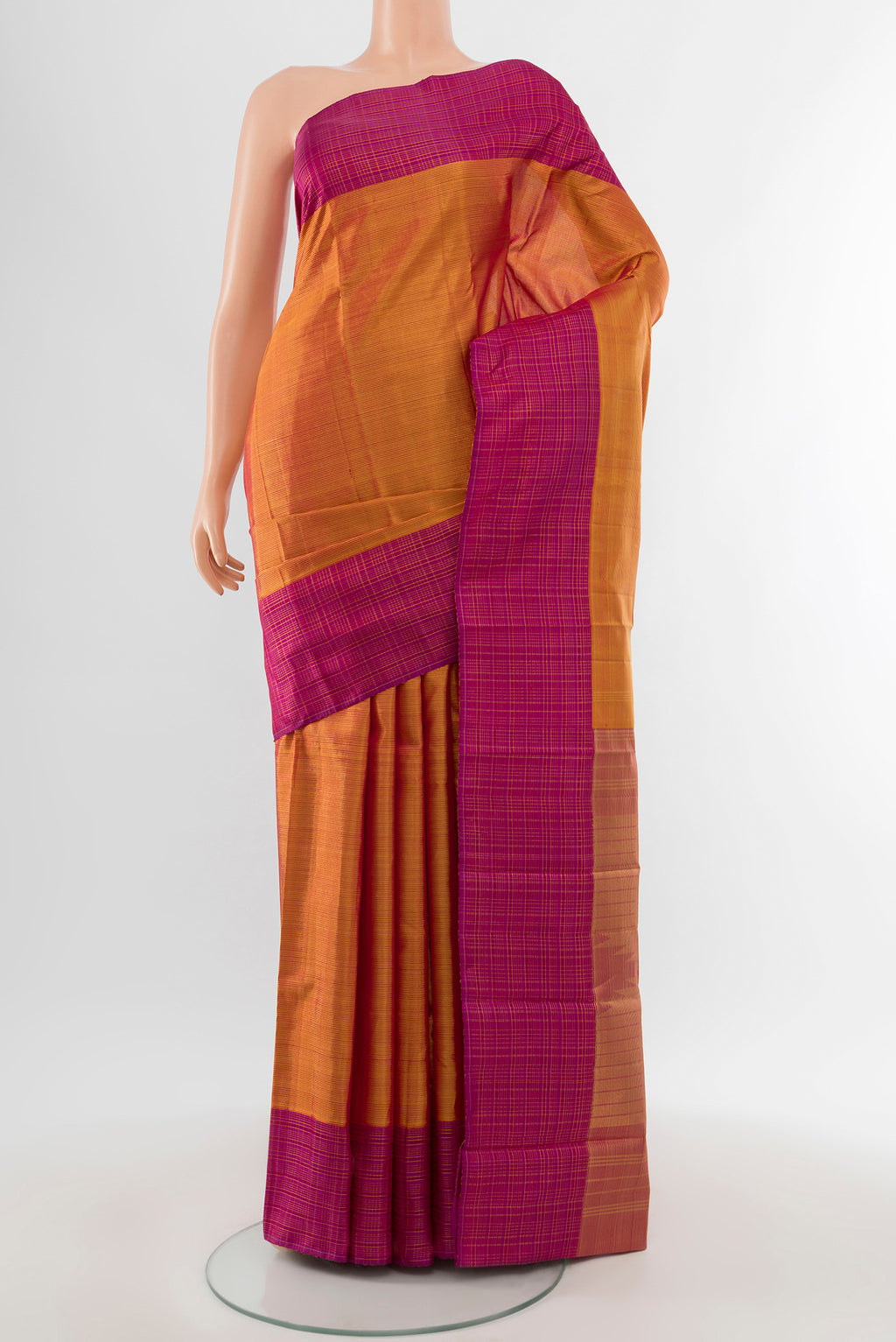 Mustard Kanjivaram Silk Saree with Stripes on the body and Checks Border.  displayed on a mannequin