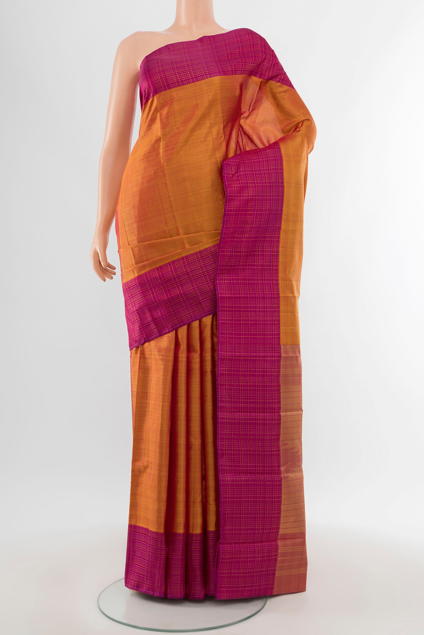 Mustard Kanjivaram Silk Saree with Stripes on the body and Checks Border.  displayed on a mannequin