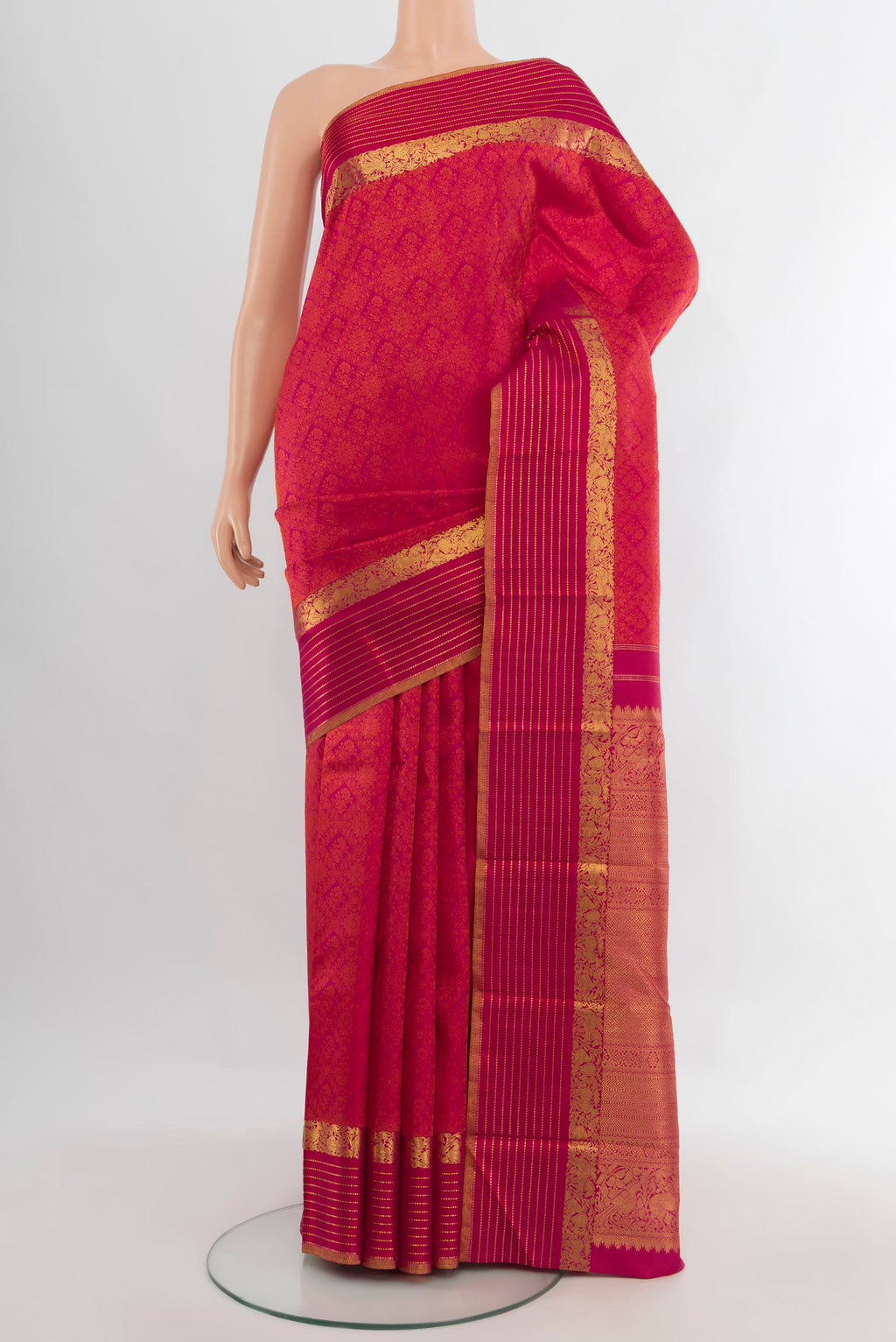 Pure Silk Dark Pink Kanchipuram Saree with Jacquard design on the body and Zari Border.  displayed on a mannequin