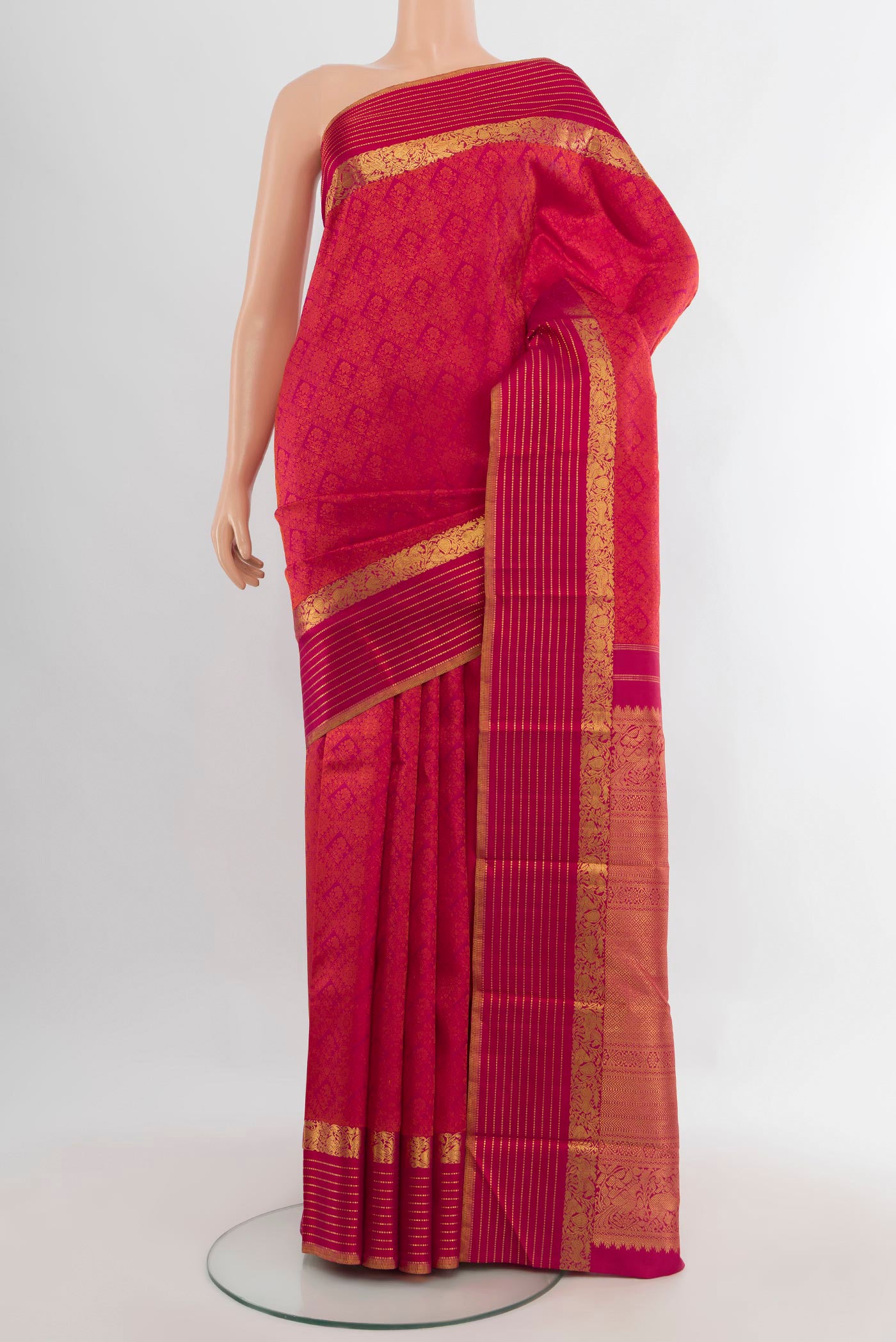 Pure Silk Dark Pink Kanchipuram Saree with Jacquard design on the body and Zari Border.  displayed on a mannequin
