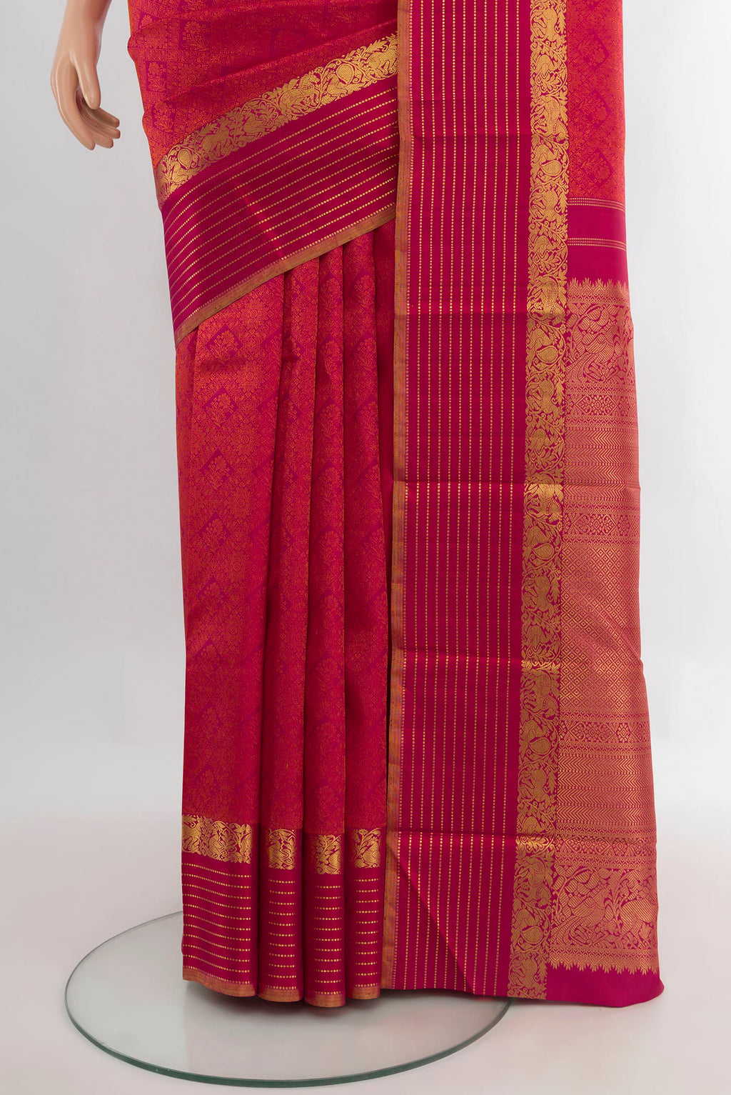 Pleats and pallu of Pure Silk Dark Pink Kanchipuram Saree with Jacquard design on the body and Zari Border. 