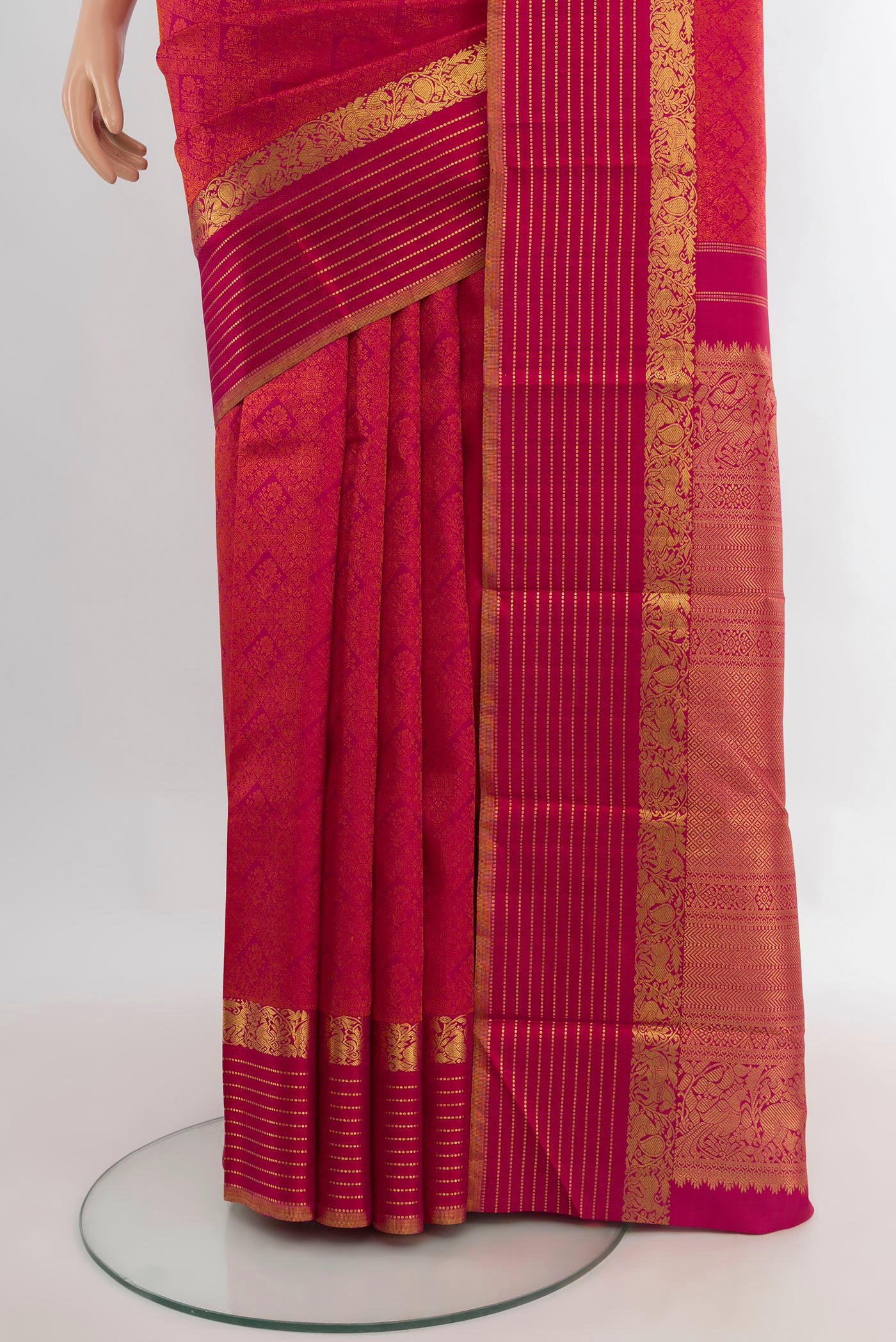 Pleats and pallu of Pure Silk Dark Pink Kanchipuram Saree with Jacquard design on the body and Zari Border. 