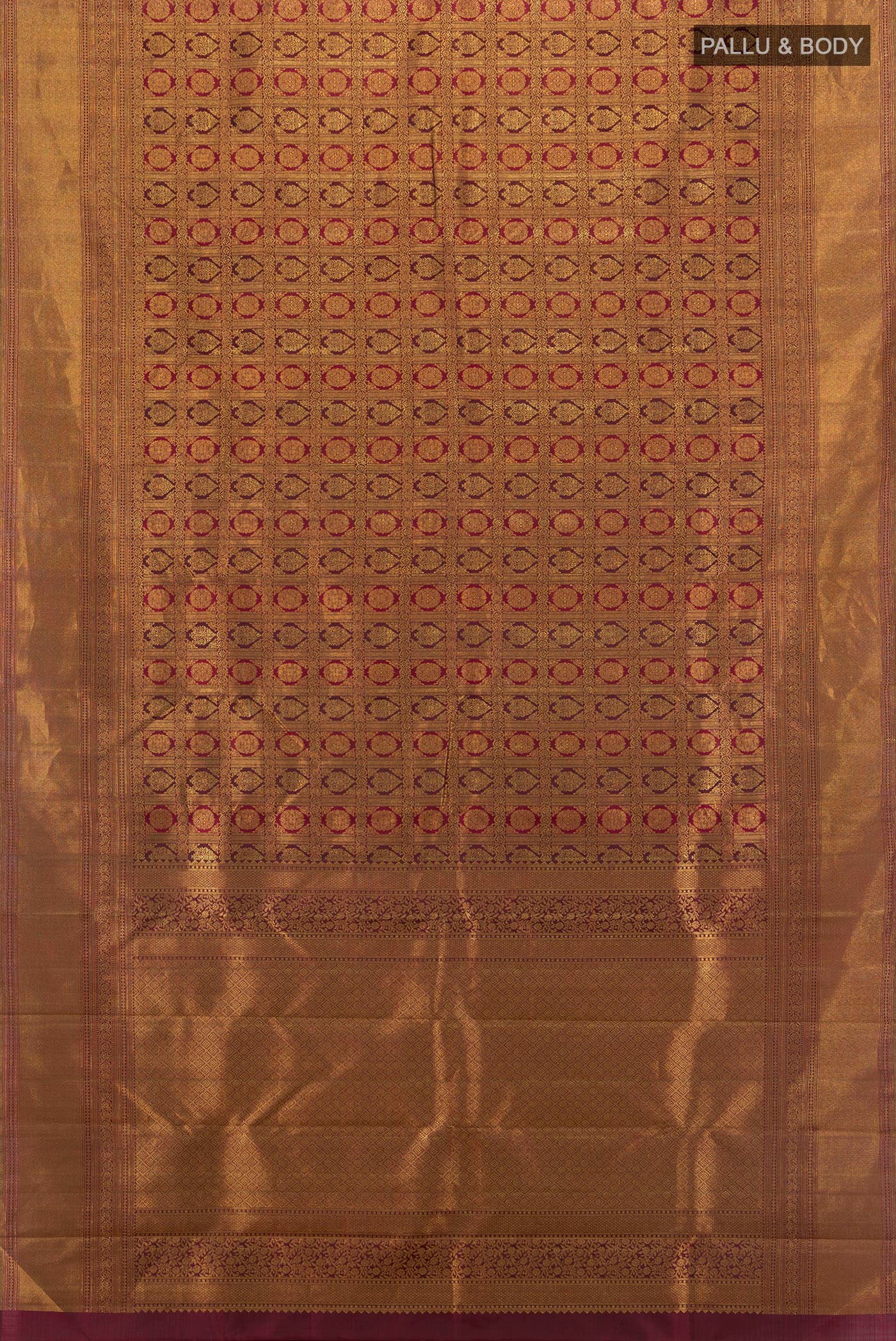 Flat view of Maroon Kanjivaram Silk Saree with Zari Brocade on the body and Zari Border. 