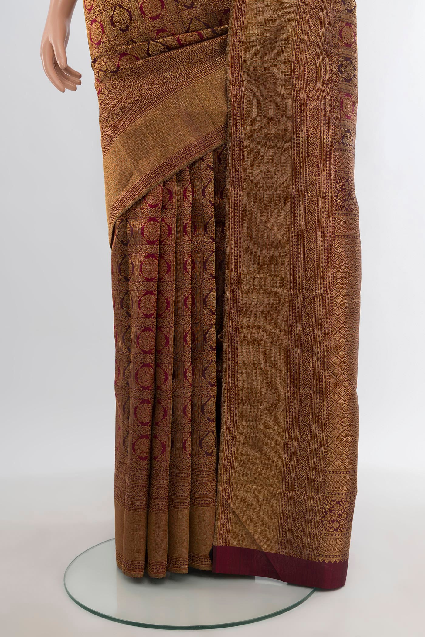 Pleats and pallu of Maroon Kanjivaram Silk Saree with Zari Brocade on the body and Zari Border. 