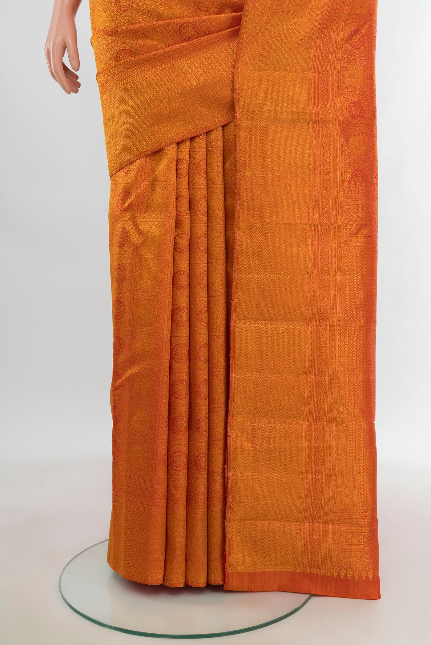 Pleats and pallu of Brick Orange Kanchipuram Silk Saree with Zari Brocade on the body and Zari Border. 