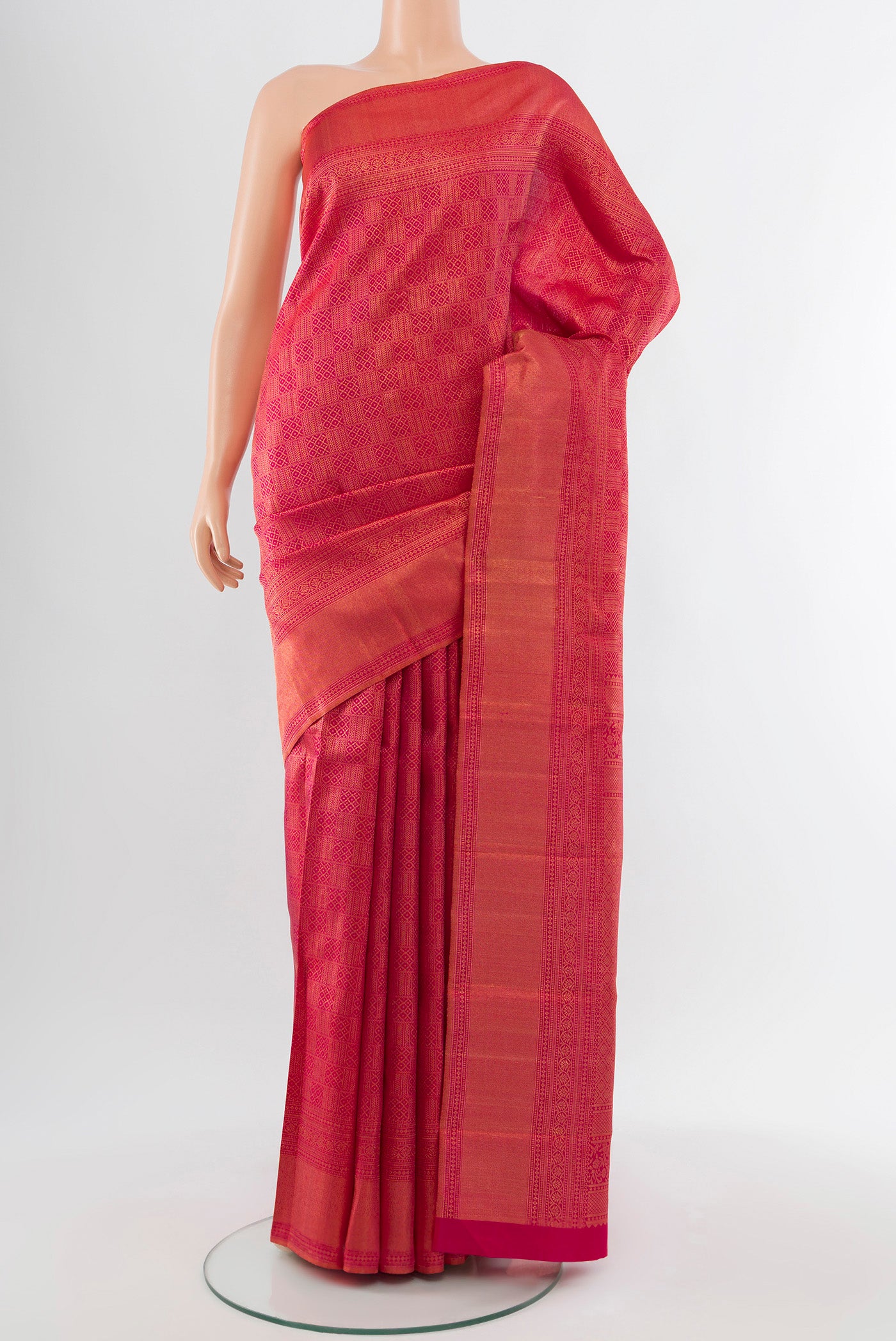 Dark Pink Kanchipuram Silk Saree with Zari Butta on the body and Silk Border.  displayed on a mannequin