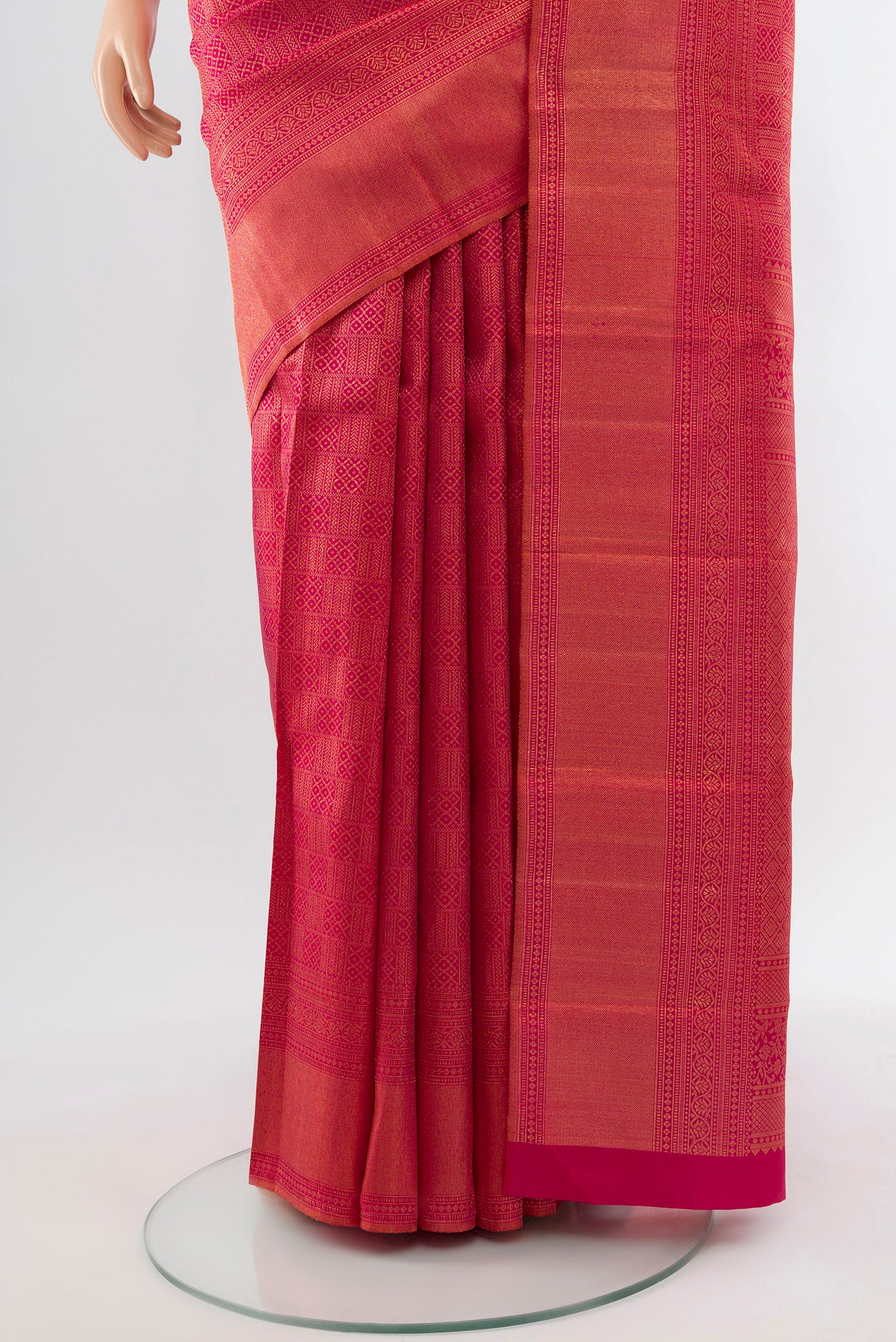 Pleats and pallu of Dark Pink Kanchipuram Silk Saree with Zari Butta on the body and Silk Border. 