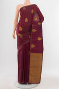 Maroon Kanjivaram Silk Saree with Zari Butta on the body and Silk Border.  displayed on a mannequin