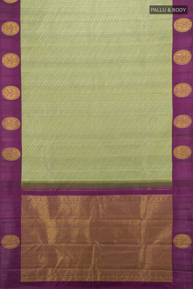 Flat view of Light Green Kanjivaram Silk Saree with Zari Butta on the body and Fancy Border. 