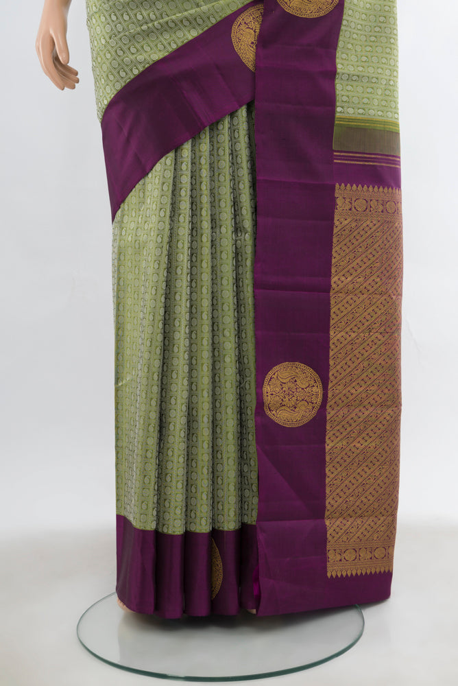 Pleats and pallu of Light Green Kanjivaram Silk Saree with Zari Butta on the body and Fancy Border. 