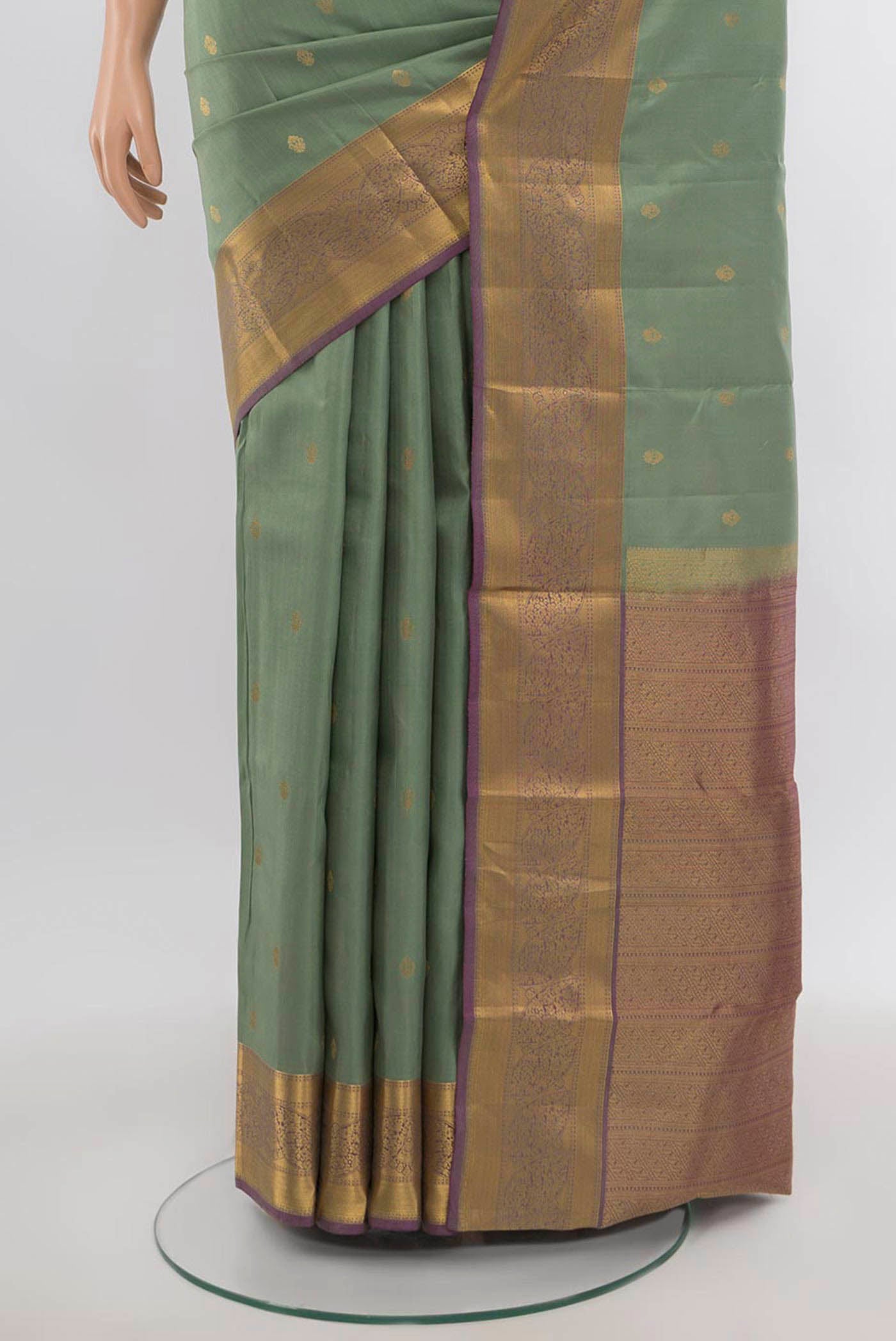 Pleats and pallu of Pista Green Kanchipuram Silk Saree with Zari Butta on the body and Silk Border. 