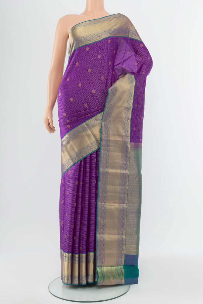 Violet Kanchipuram Silk Saree with Zari Butta on the body and Silk Border.  displayed on a mannequin