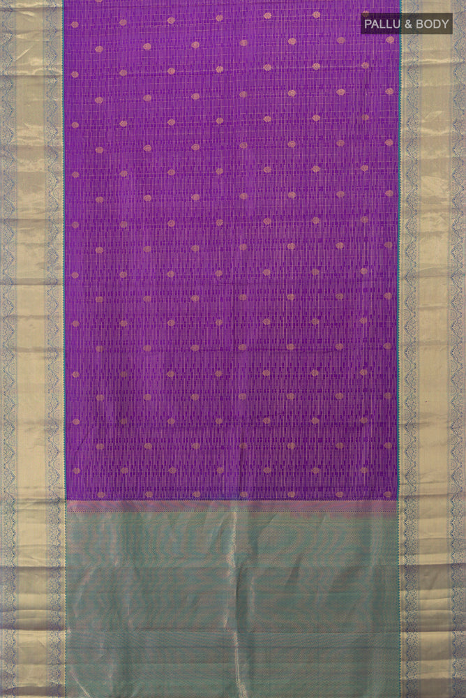 Flat view of Violet Kanchipuram Silk Saree with Zari Butta on the body and Silk Border. 