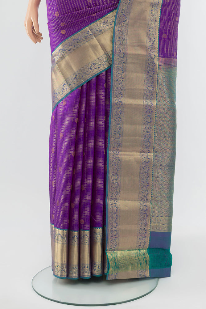 Pleats and pallu of Violet Kanchipuram Silk Saree with Zari Butta on the body and Silk Border. 