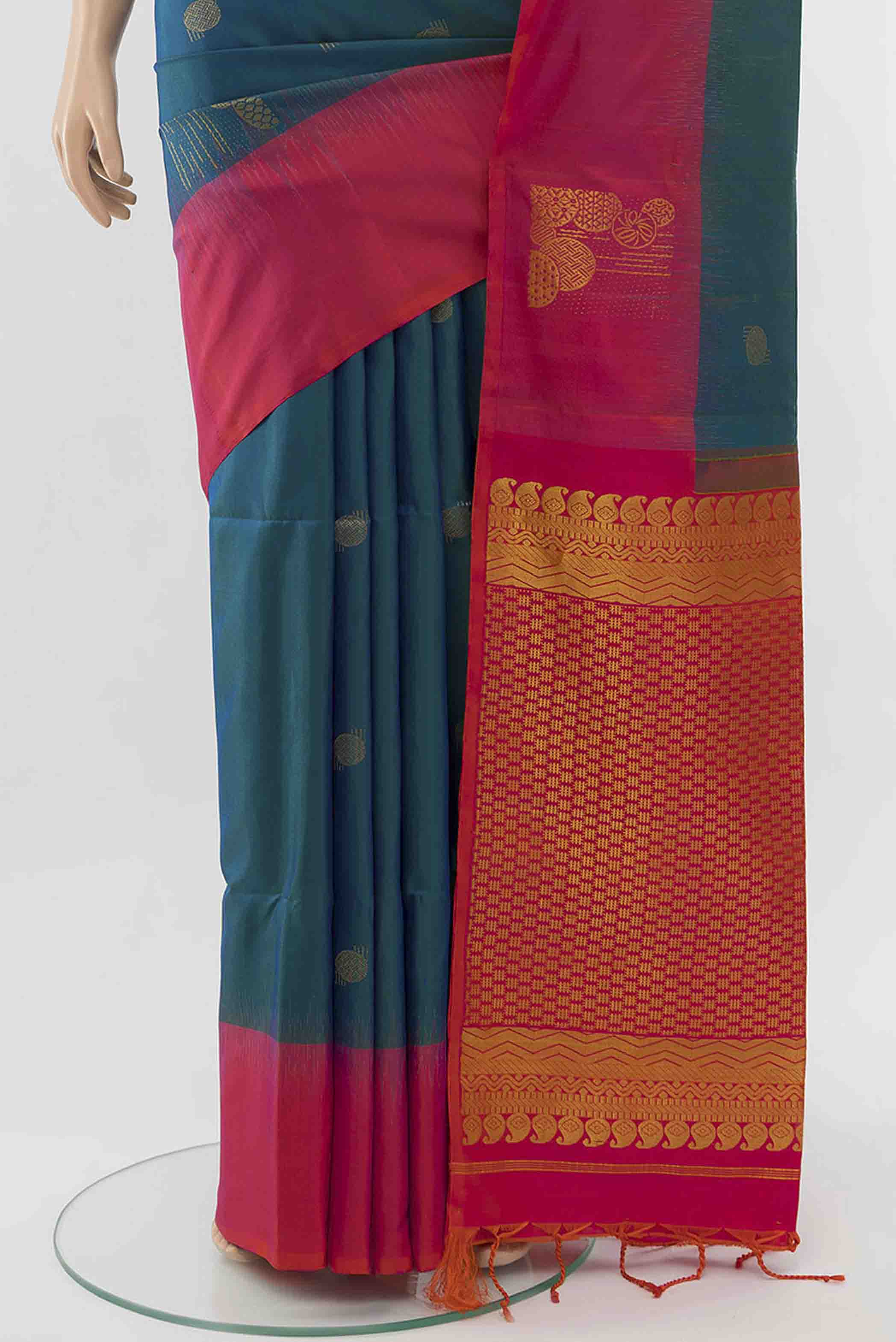 Pleats and pallu of Peacock Blue Soft Silk Saree with Zari Butta on the body and Silk Border
