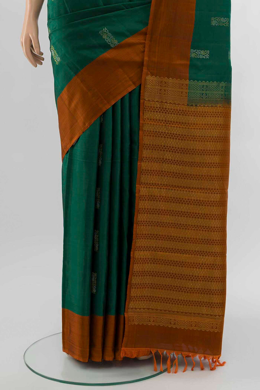 Pleats and pallu of Bottle Green Kanchipuram Silk Saree with Zari Brocade on the body and Silk Border