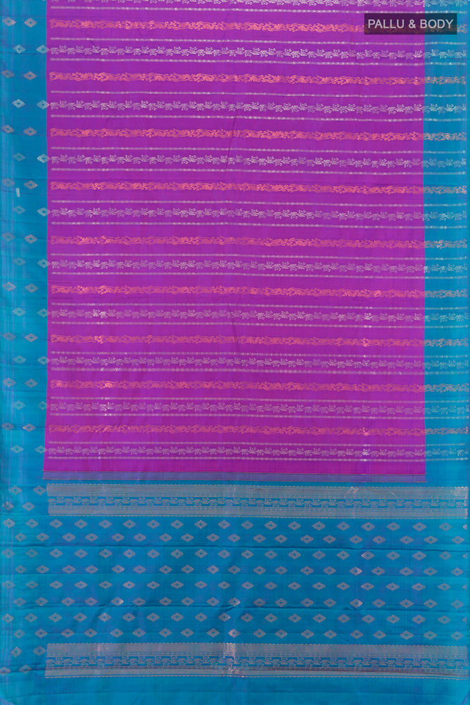 Flat view of Purple Kanchipuram Silk Saree with Zari Butta on the body and Silk Border. 