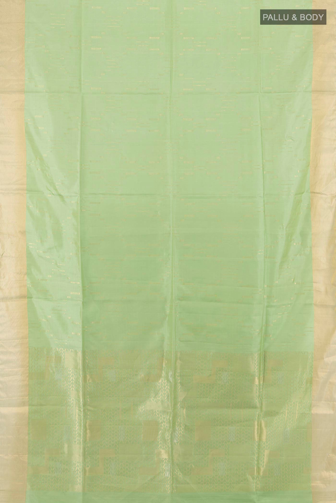 Flat view of Pista Green Soft Silk Saree with Zari Butta on the body and Zari Border. 