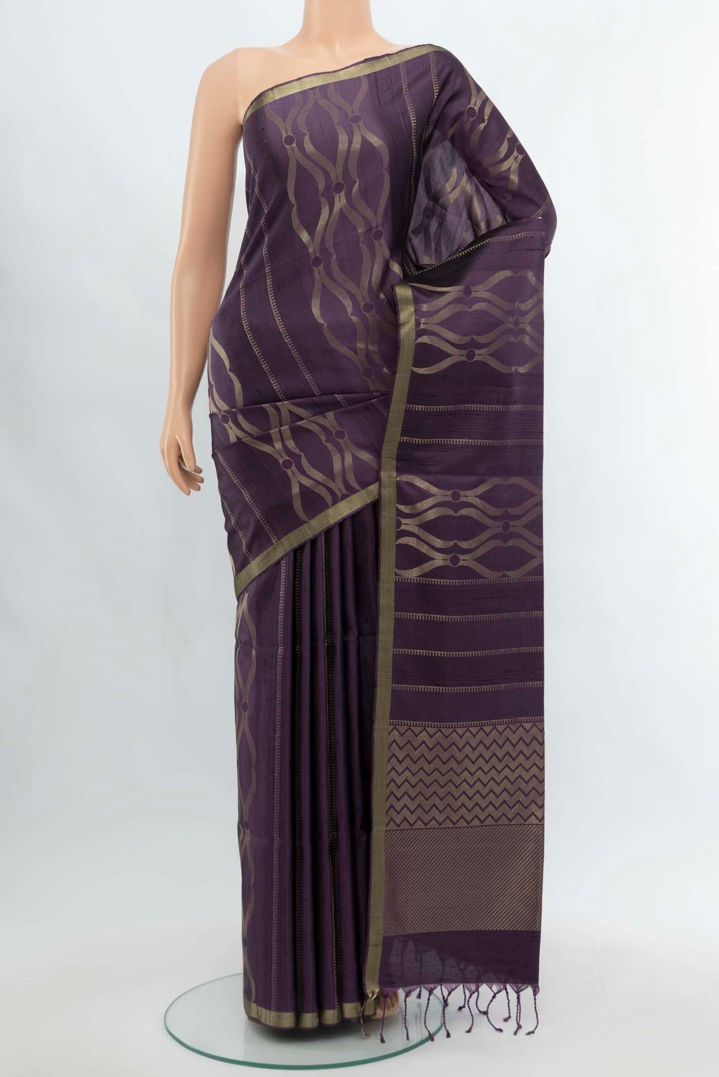 Purple Soft Silk Saree with Zari Butta on the body and Silk Border.  displayed on a mannequin