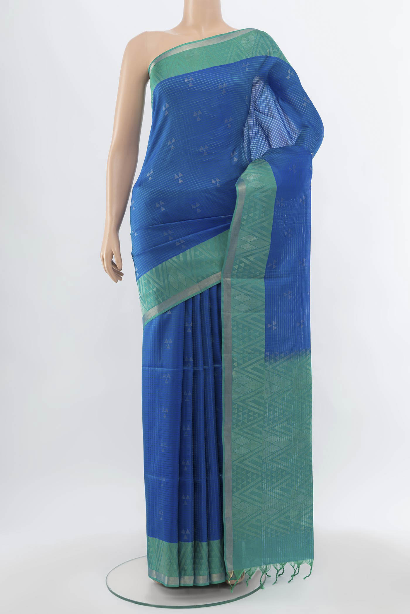 Light Blue Soft Silk Saree with Zari Butta on the body and Zari Border.  displayed on a mannequin