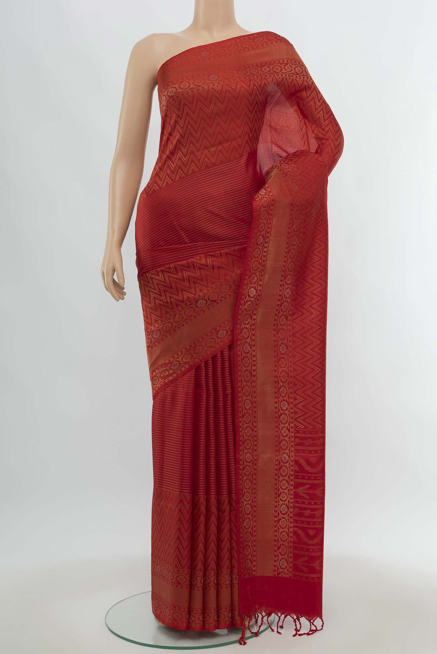 Red Soft Silk Saree with Zari Butta on the body and Silk Border.  displayed on a mannequin