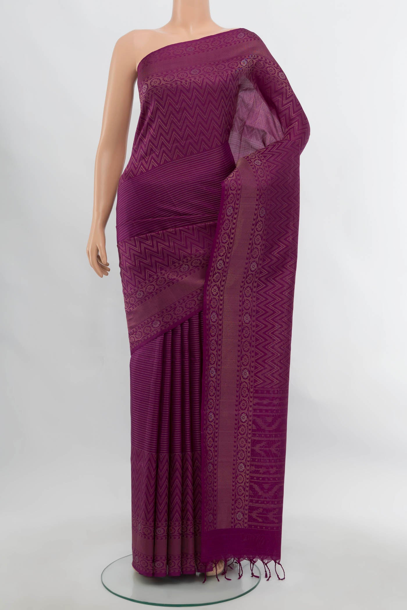 Purple Soft Silk Saree with Zari Butta on the body and Silk Border.  displayed on a mannequin