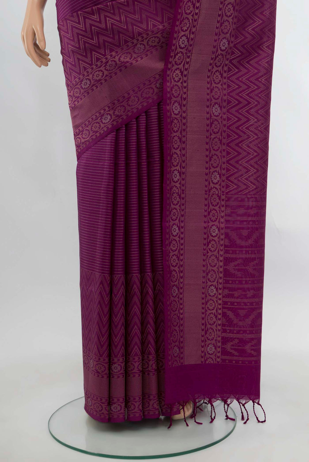 Pleats and pallu of Purple Soft Silk Saree with Zari Butta on the body and Silk Border. 