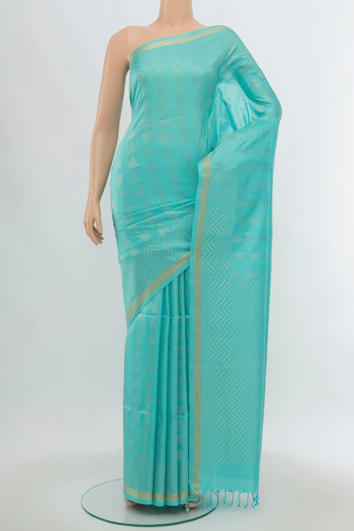 Sky Blue Soft Silk Saree with Zari Butta on the body and Silk Border.  displayed on a mannequin