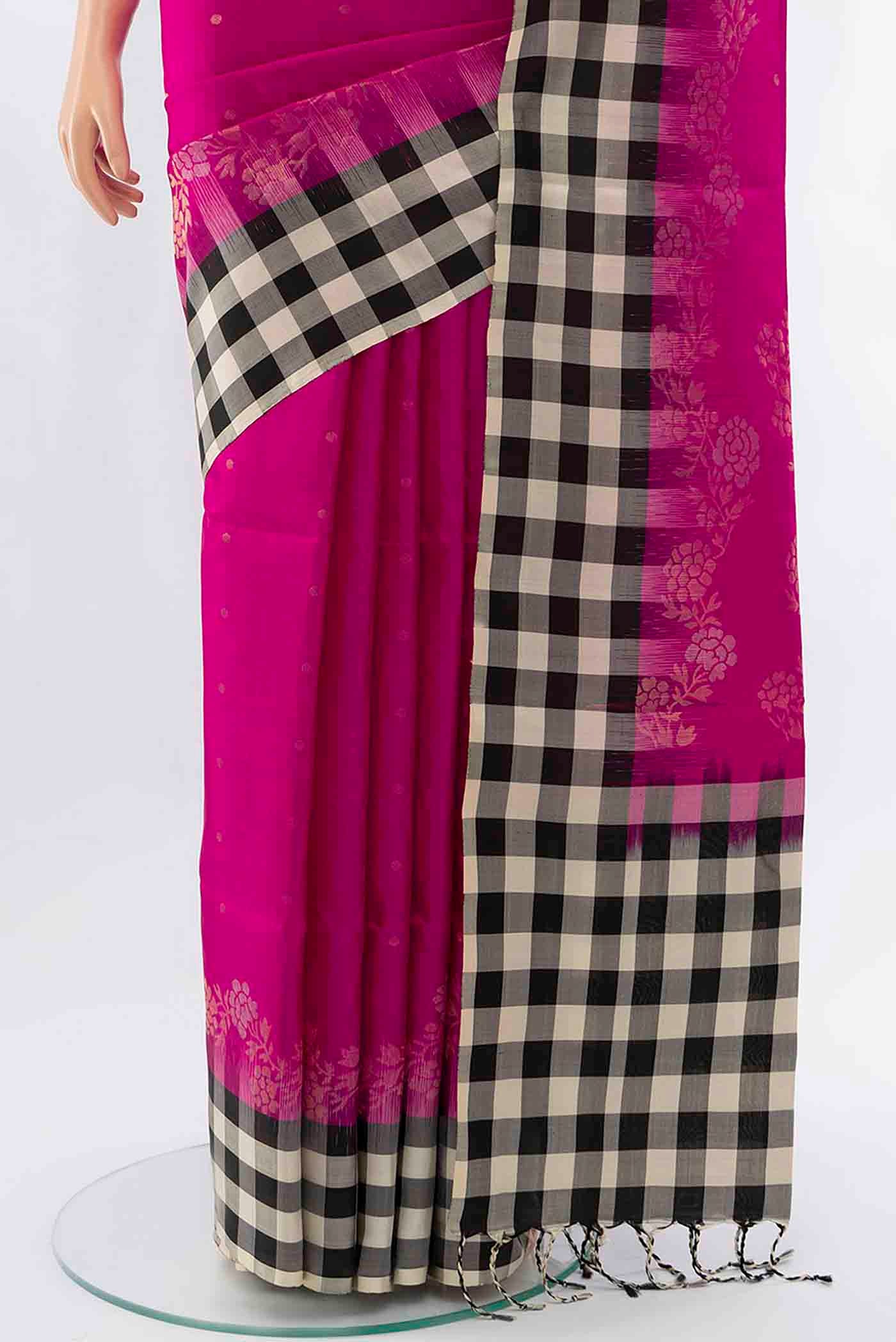 Pleats and pallu of Rani Pink Soft Silk Saree with Zari Butta on the body and Checks Border