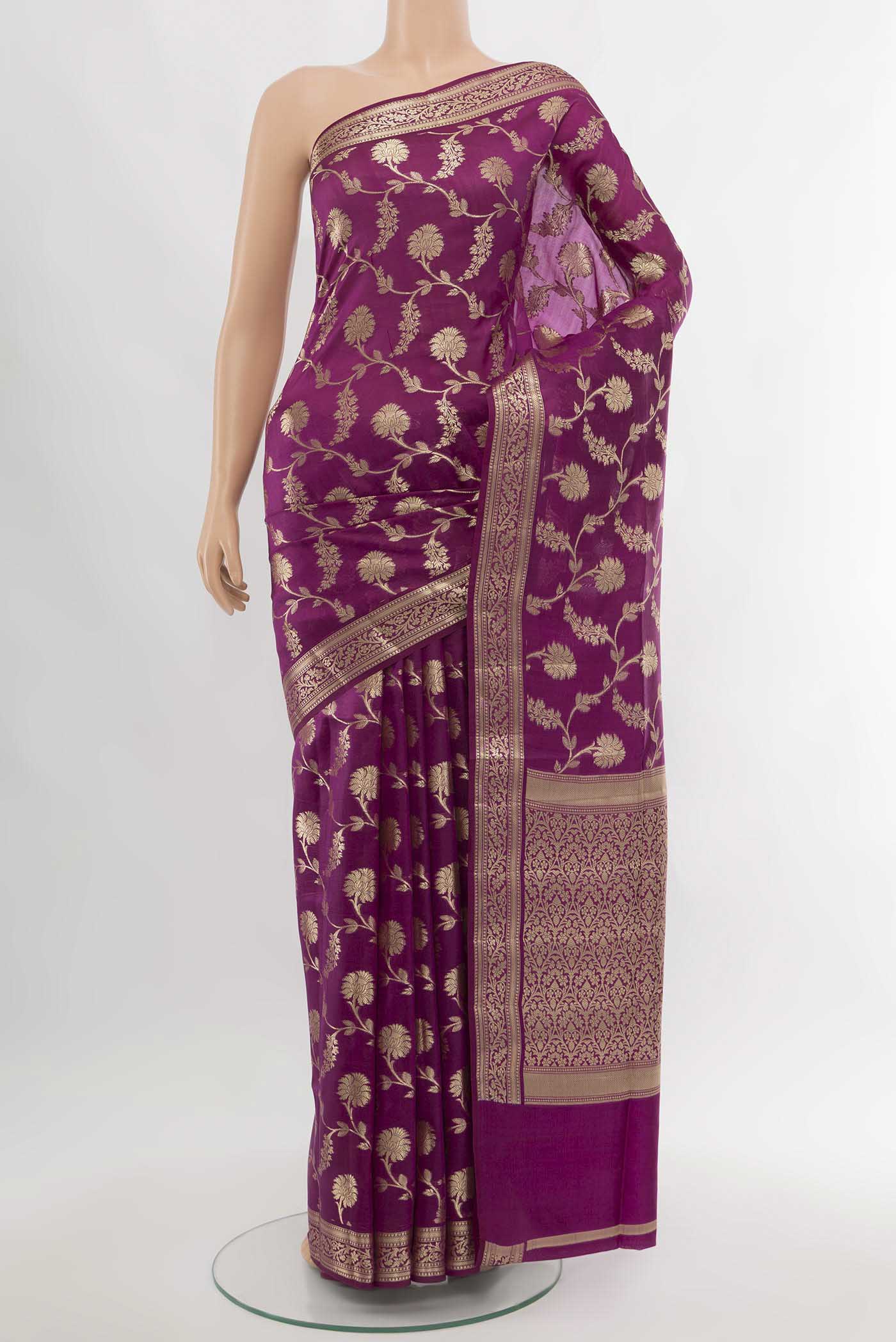 Purple Banarasi Raw Silk Saree with Zari Butta on the body and Silk Border.  displayed on a mannequin