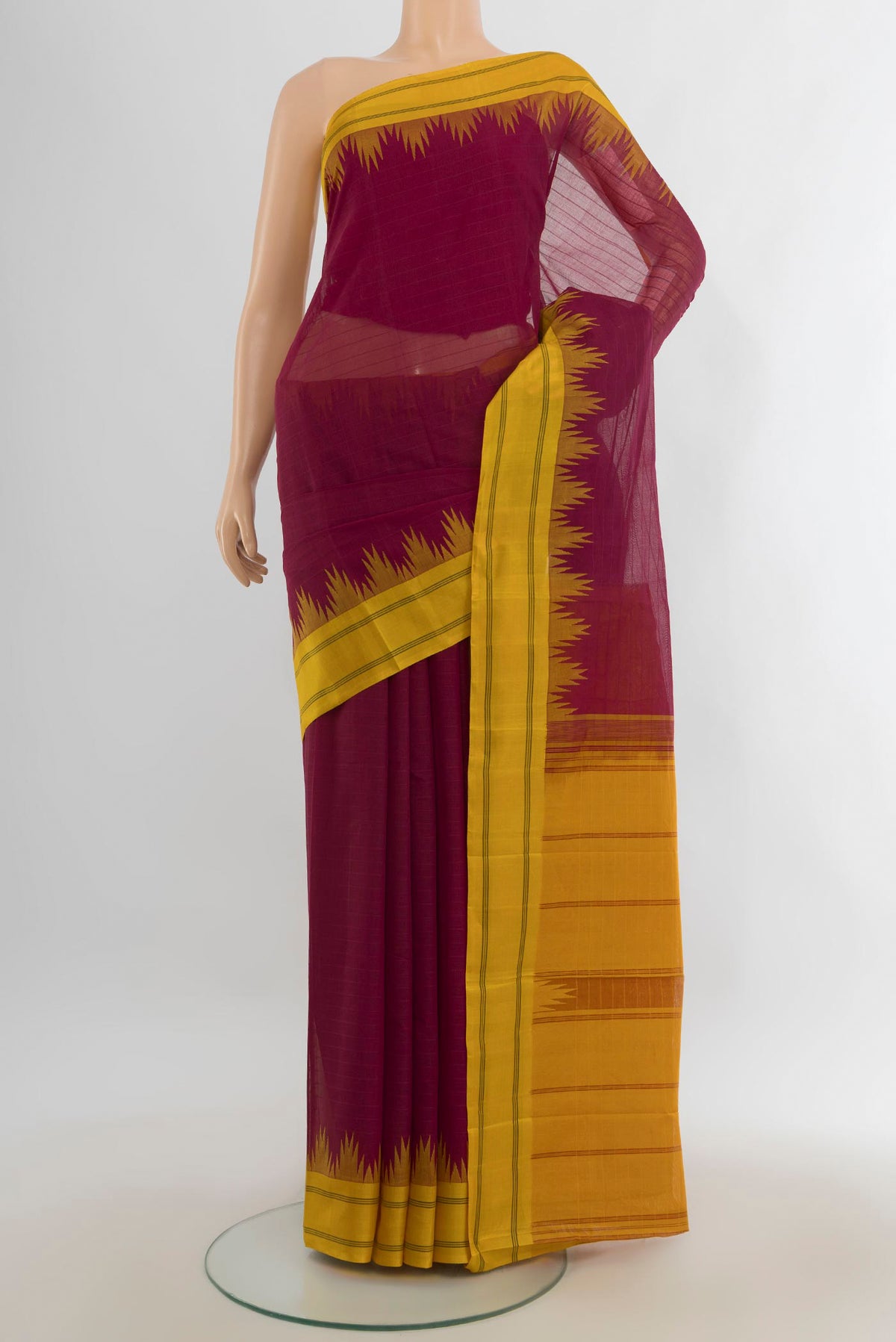 Maroon Kanchi Cotton Saree with Plain Body and Silk Border.  displayed on a mannequin