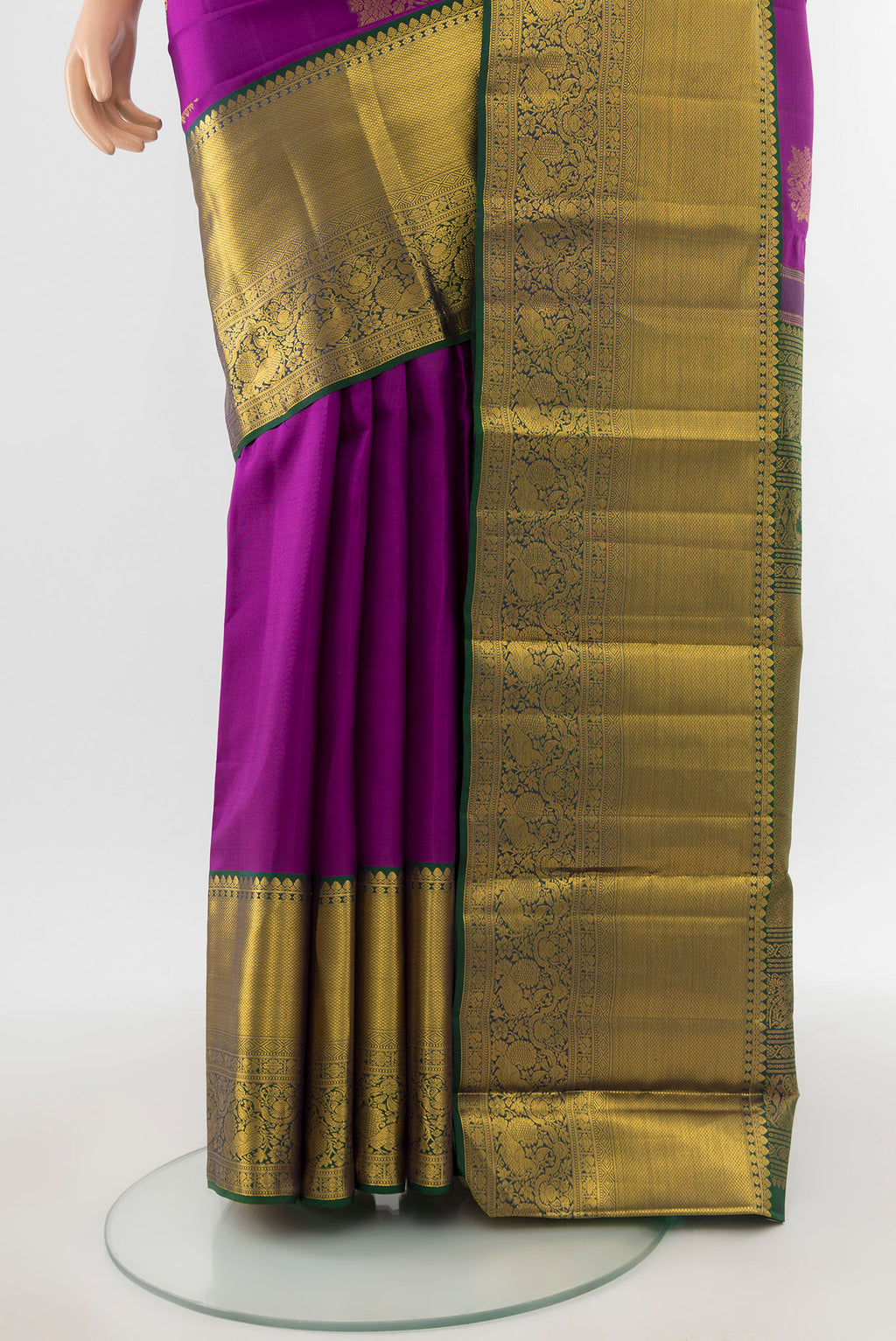 Pleats and pallu of Pure Silk Pure Zari Magenta Kanchipuram Saree with Zari Butta on the body and Silk Border. 