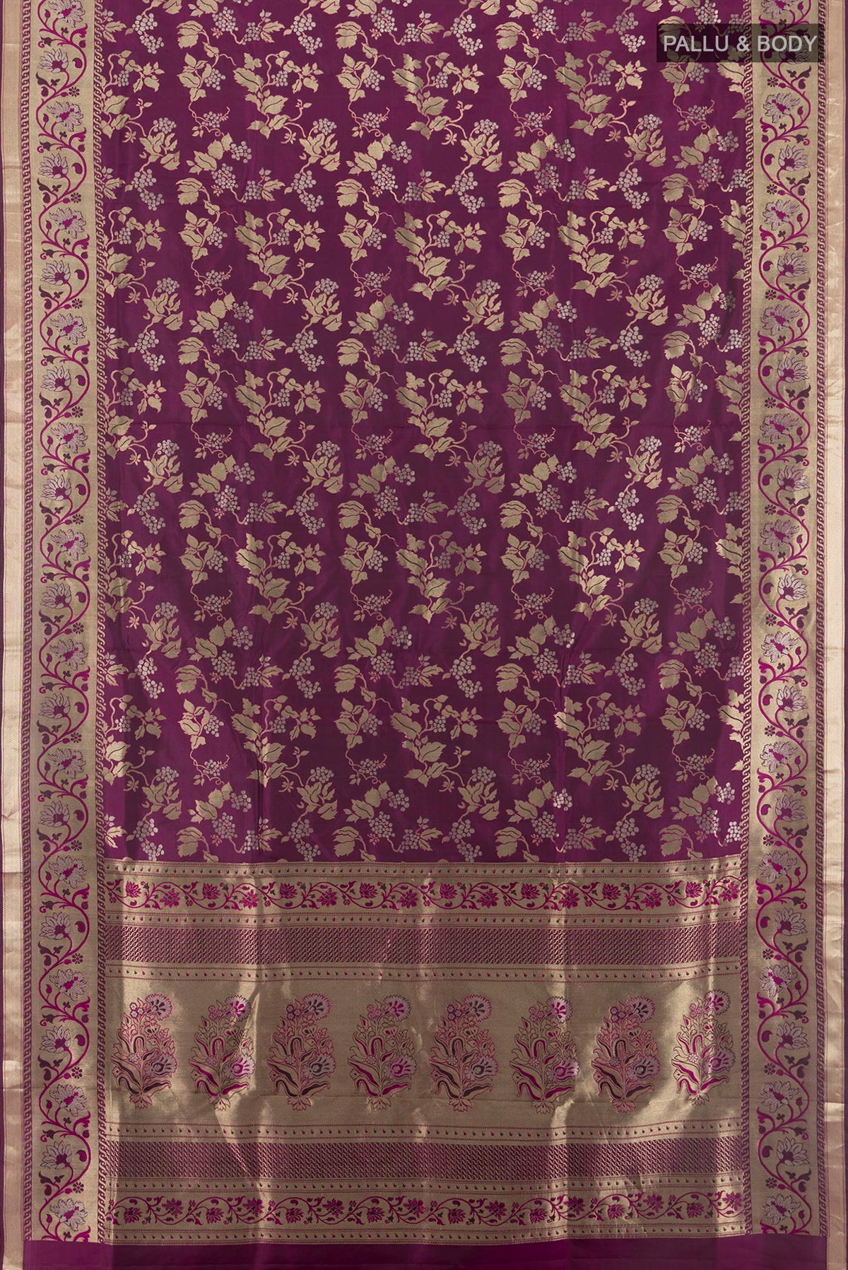 Flat view of Pure Silk Magenta Soft Saree with Zari Brocade on the body and Zari Border. 