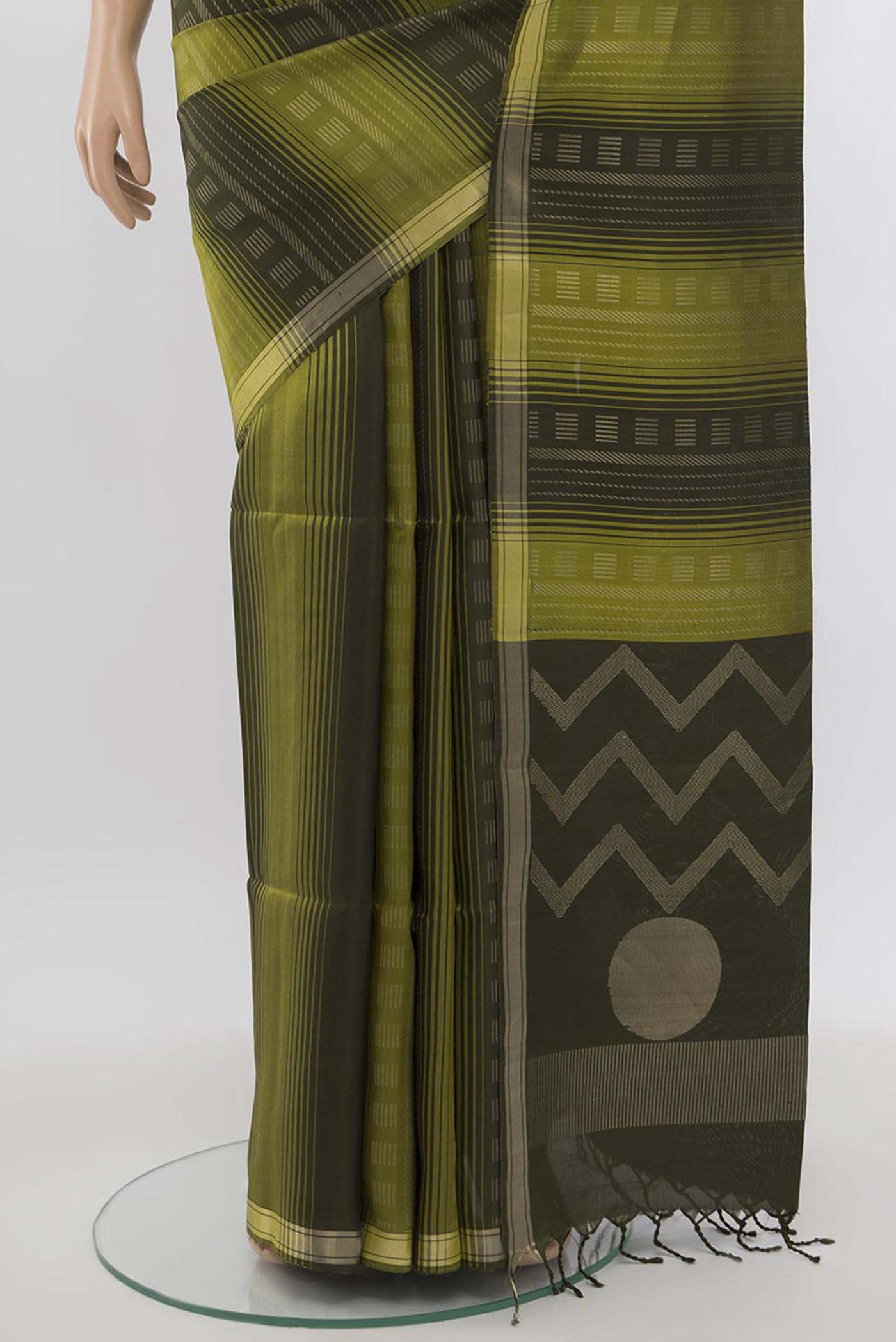 Pleats and pallu of Light Green Soft Silk Saree with Zari Butta on the body and Silk Border. 