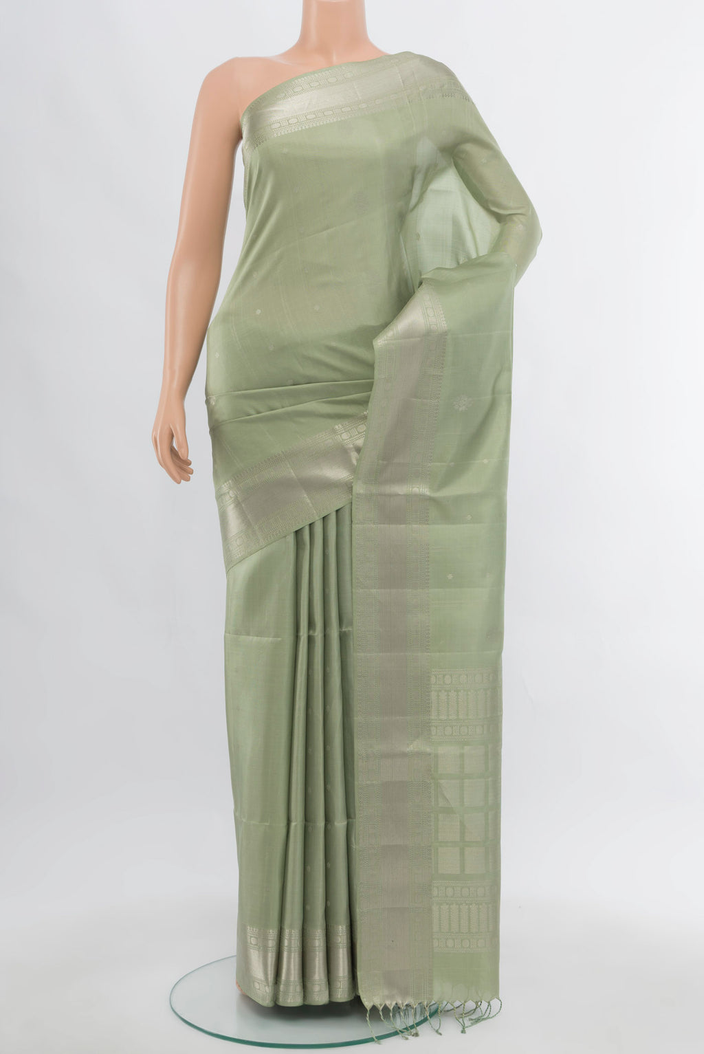 Olive Green Soft Silk Saree with Zari Butta on the body and Silk Border.  displayed on a mannequin