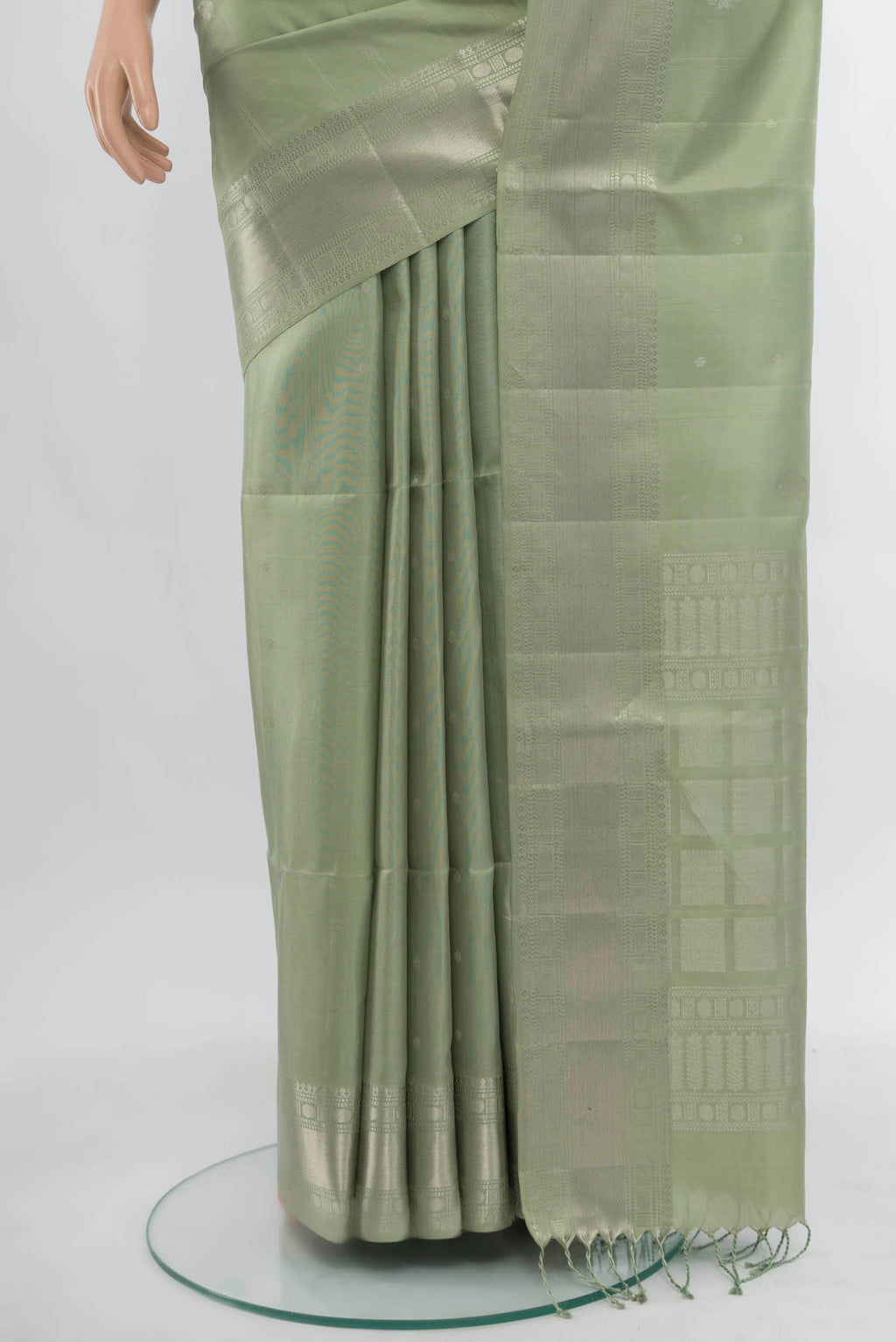 Pleats and pallu of Olive Green Soft Silk Saree with Zari Butta on the body and Silk Border. 