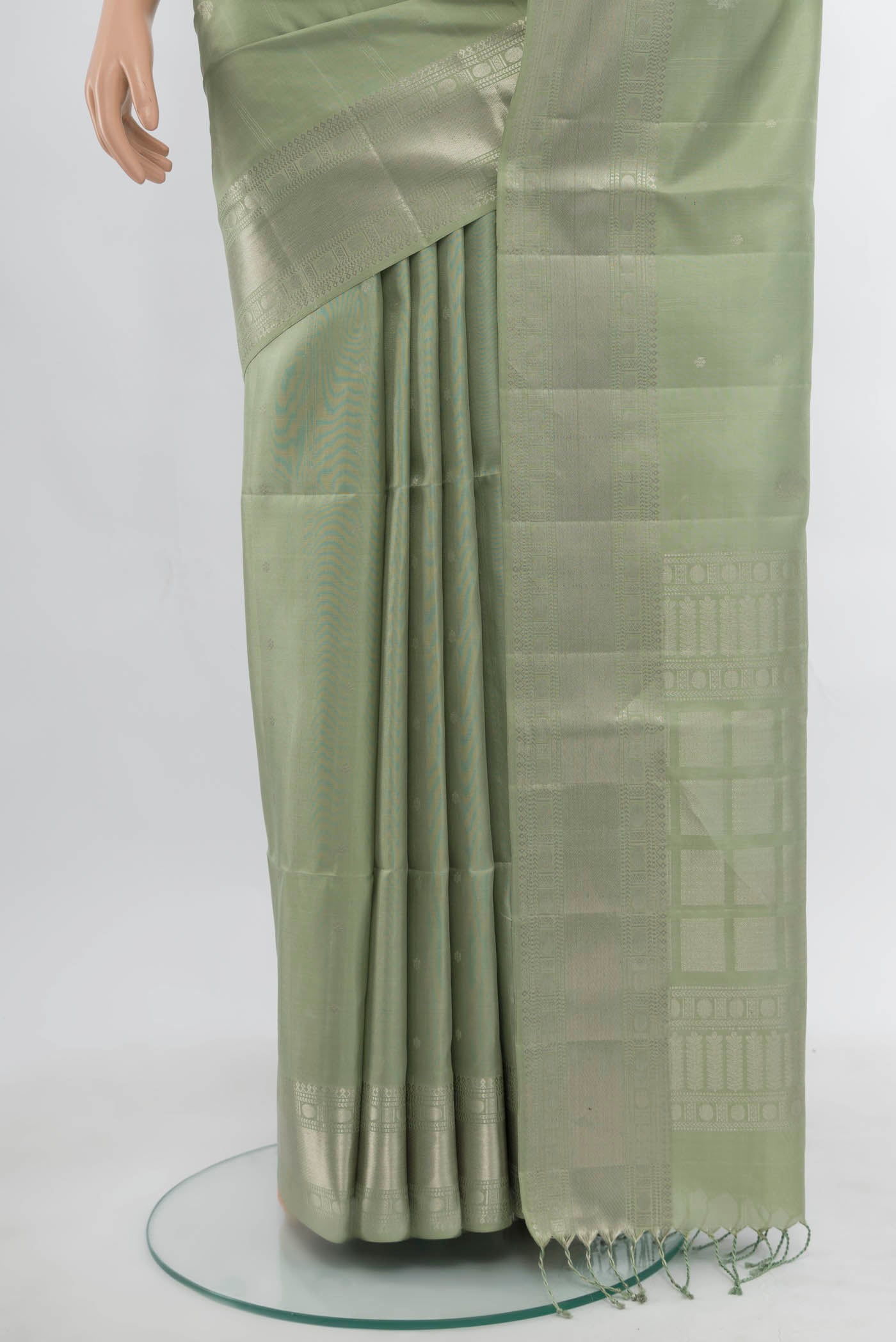 Pleats and pallu of Olive Green Soft Silk Saree with Zari Butta on the body and Silk Border. 