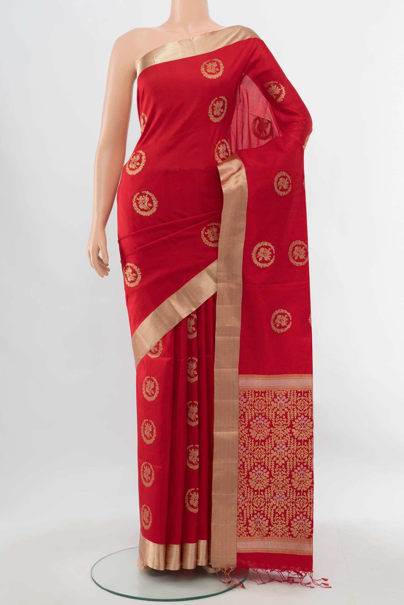 Red Soft Silk Saree with Zari Butta on the body and Silk Border.  displayed on a mannequin
