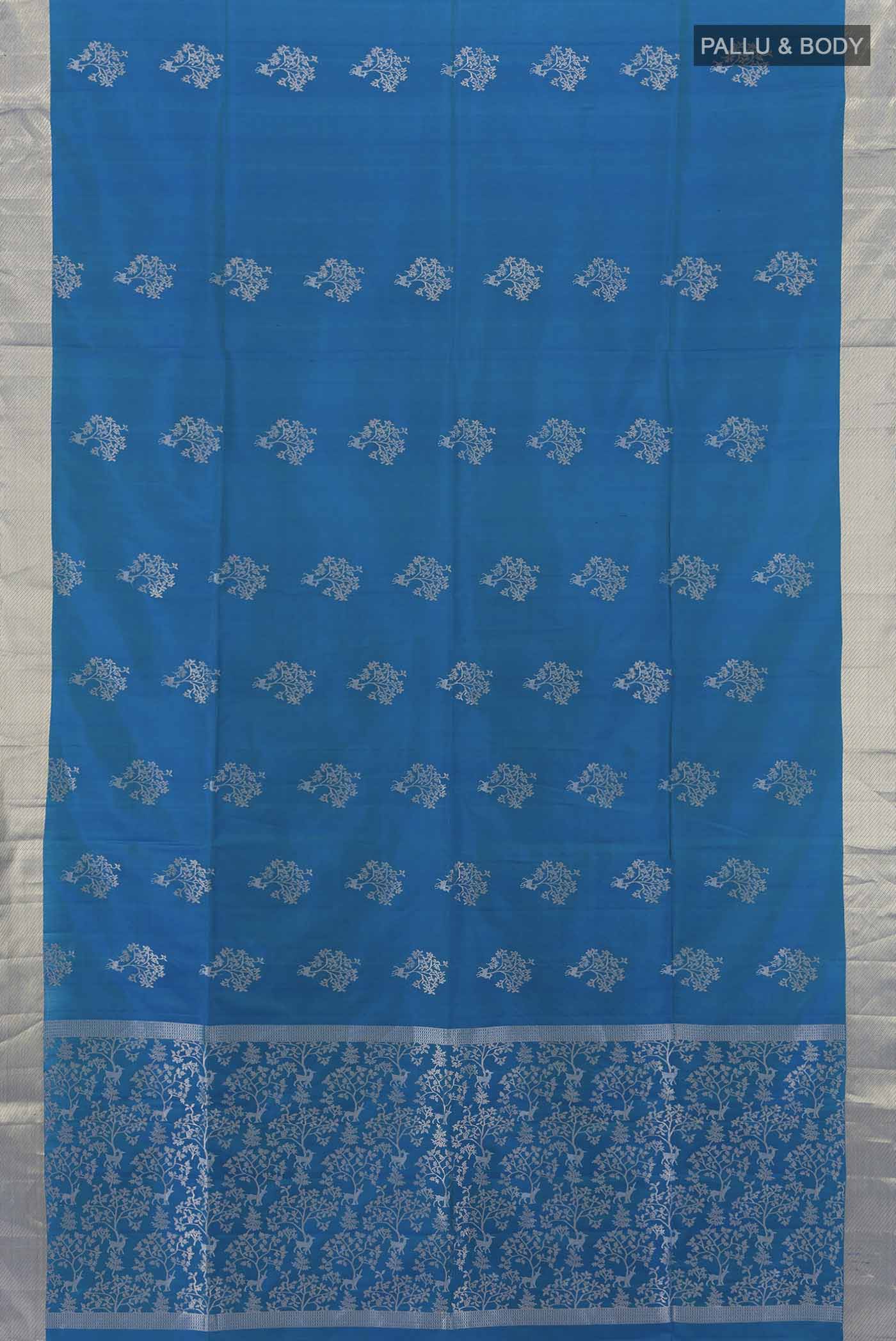 Flat view of Light Blue Soft Silk Saree with Zari Butta on the body and Silk Border. 