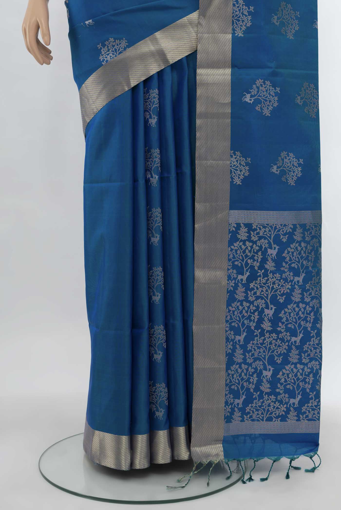 Pleats and pallu of Light Blue Soft Silk Saree with Zari Butta on the body and Silk Border. 