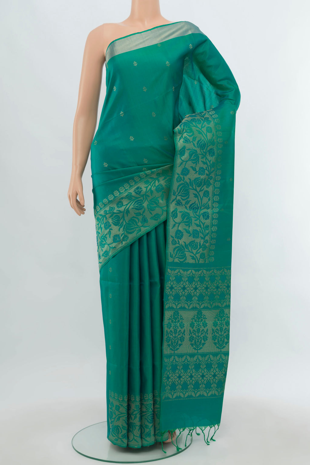 Light Green Soft Silk Saree with Zari Butta on the body and Silk Border.  displayed on a mannequin