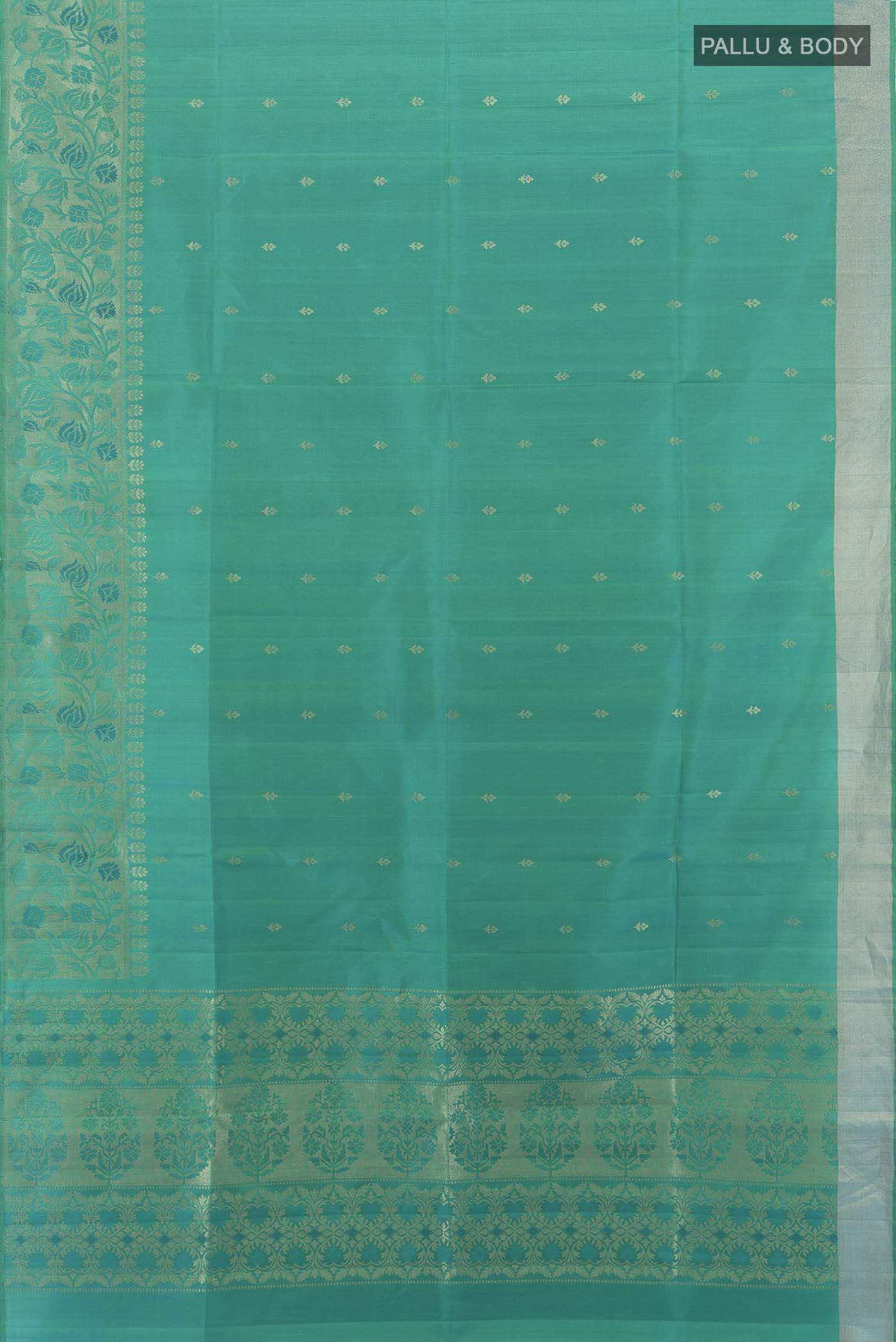 Flat view of Light Green Soft Silk Saree with Zari Butta on the body and Silk Border. 