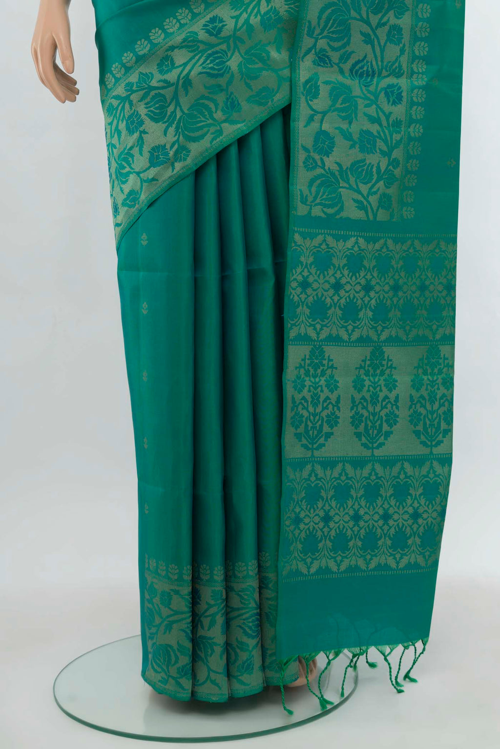 Pleats and pallu of Light Green Soft Silk Saree with Zari Butta on the body and Silk Border. 