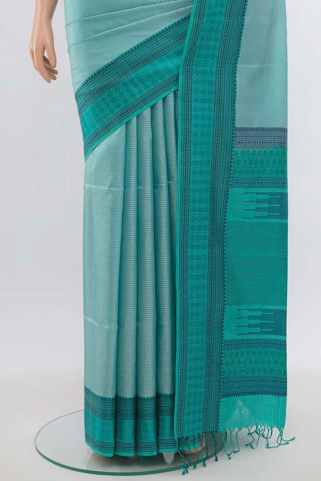 Pleats and pallu of Light Blue Soft Silk Saree with Zari Butta on the body and Silk Border. 
