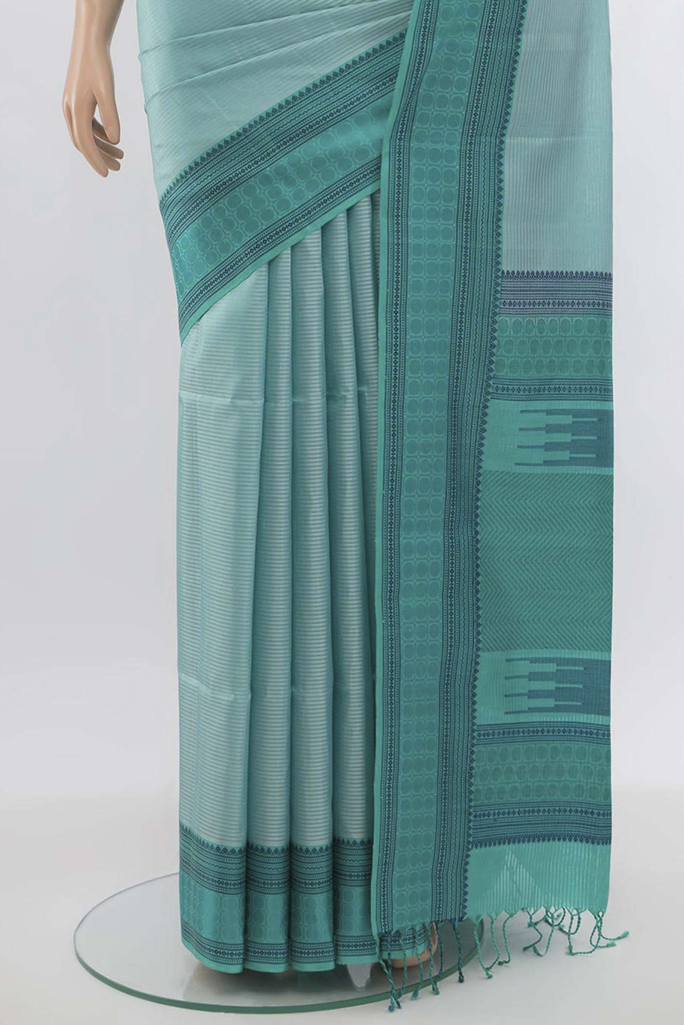 Pleats and pallu of Light Blue Soft Silk Saree with Zari Butta on the body and Silk Border. 